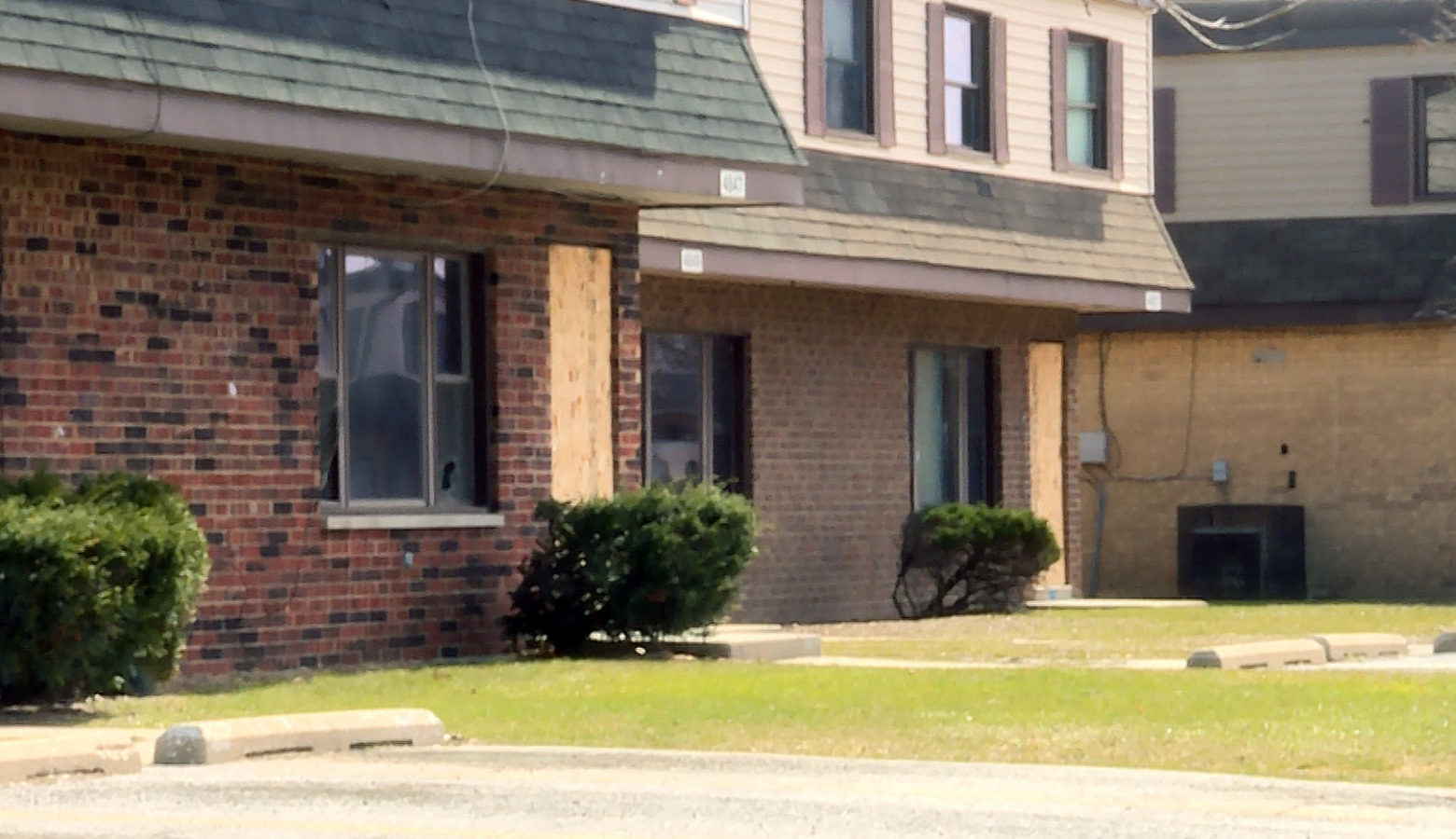 Some homes in West Calumet Housing Complex are already boarded up ahead of Friday's deadline for the 60 or so families left there to move out. (Lauren Chapman/IPB News)