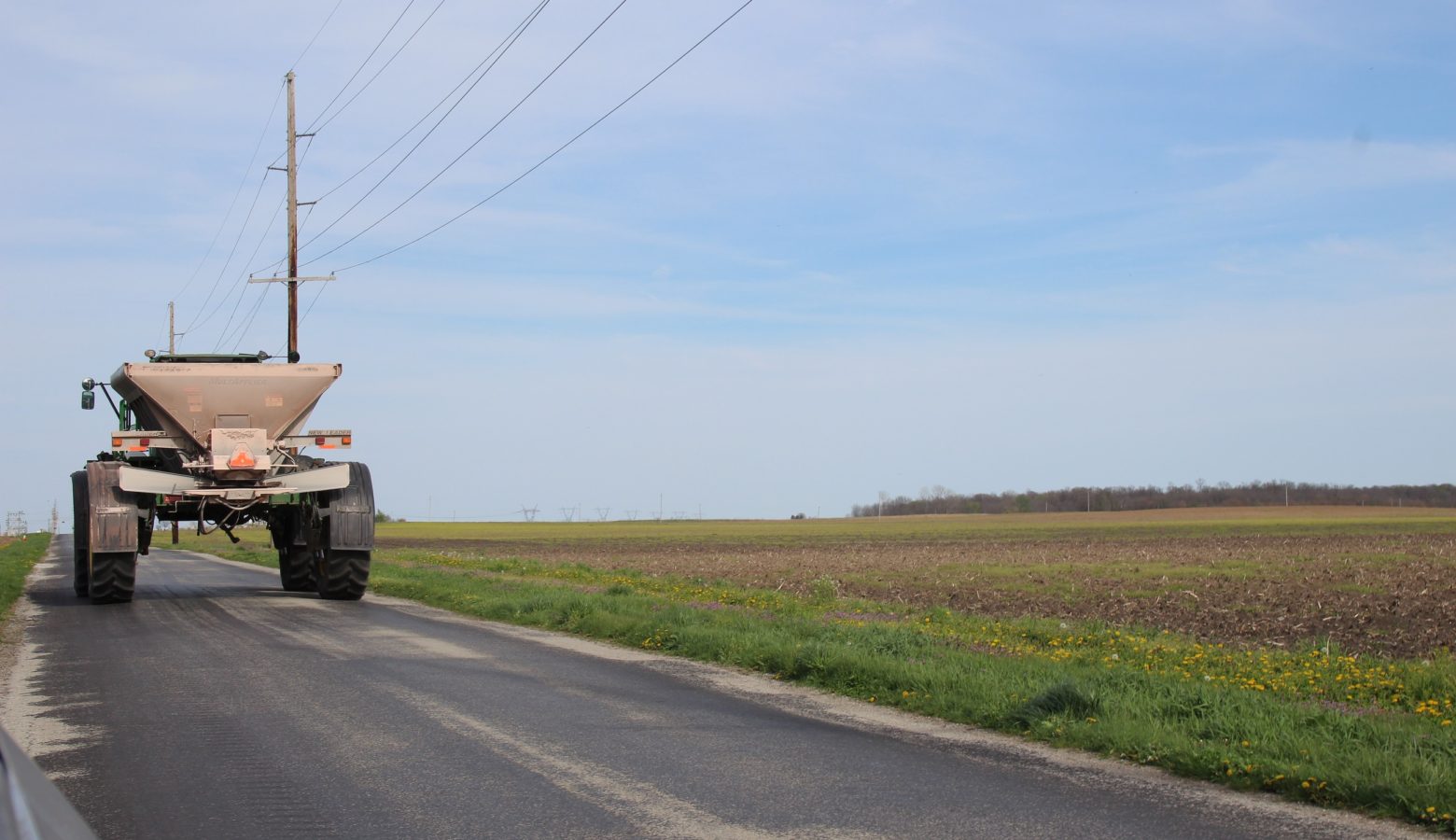 A farmer drives his equipment to a maintenance facility in Brookston on Monday ahead of spring planting. (Annie Ropeik/IPB News)