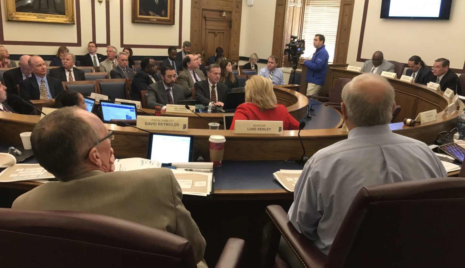 Members of the State Budget Committee listen as fiscal analysts present the new state revenue forecast. (Brandon Smith/IPB News)