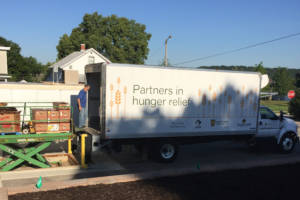 Food is unloaded at the Lafayette-based Food Finders. (Jill Sheridan/IPB News)