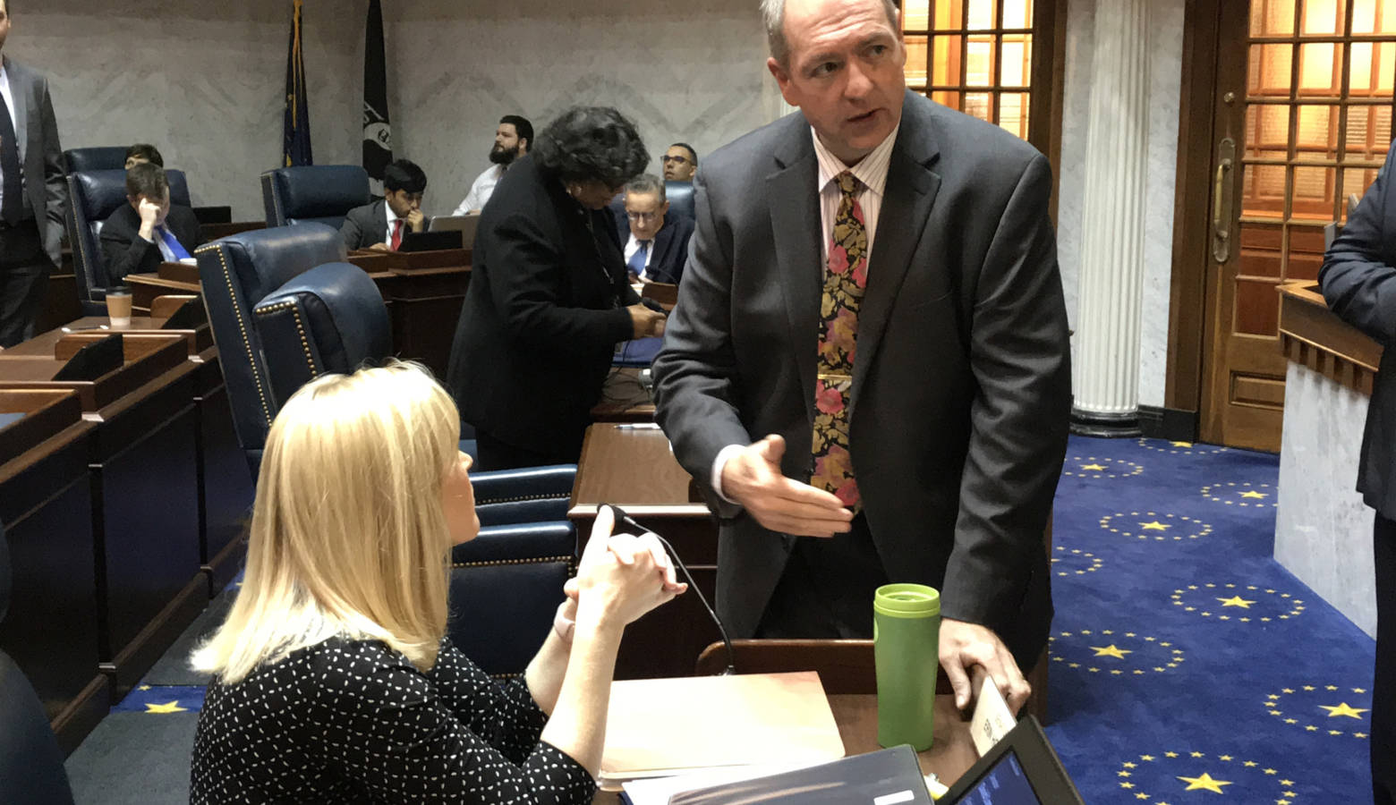 Elections Committee Chair Sen. Greg Walker (R-Columbus) talks with fellow lawmakers ahead of a committee meeting. (Brandon Smith/IPB News)