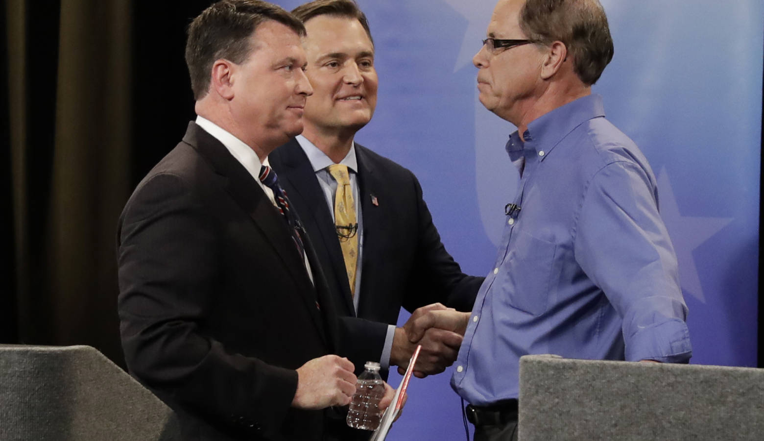 Indiana's Republican U.S. Senate candidates (from left) Rep. Todd Rokita (R-Brownsburg), Rep. Luke Messer (R-Greensburg), and Mike Braun greet each other after the final debate before the May primary election. (Darron Cummings/Indiana Debate Commission)