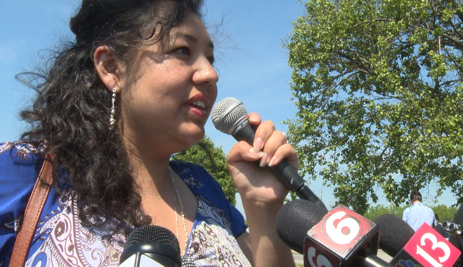 Erika Fierro speaks to media after returning from her immigration check-in. She was concerned Thursday's check-in would end in her immediate deportation. (Lauren Chapman/IPB News)