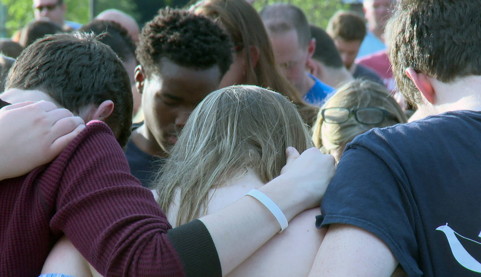 Noblesville students embrace for a community prayer during the vigil. (Lauren Chapman/IPB News)