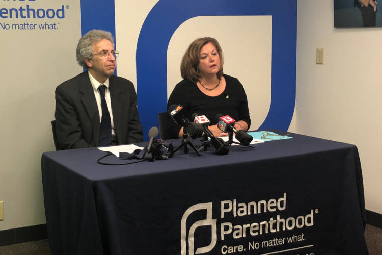 ACLU of Indiana Legal Director Ken Falk (left) and Planned Parenthood of Indiana and Kentucky CEO Christie Gillespie (right) discuss a federal judge halting Indiana's abortion reporting law. (Sarah Panfil/WFYI)