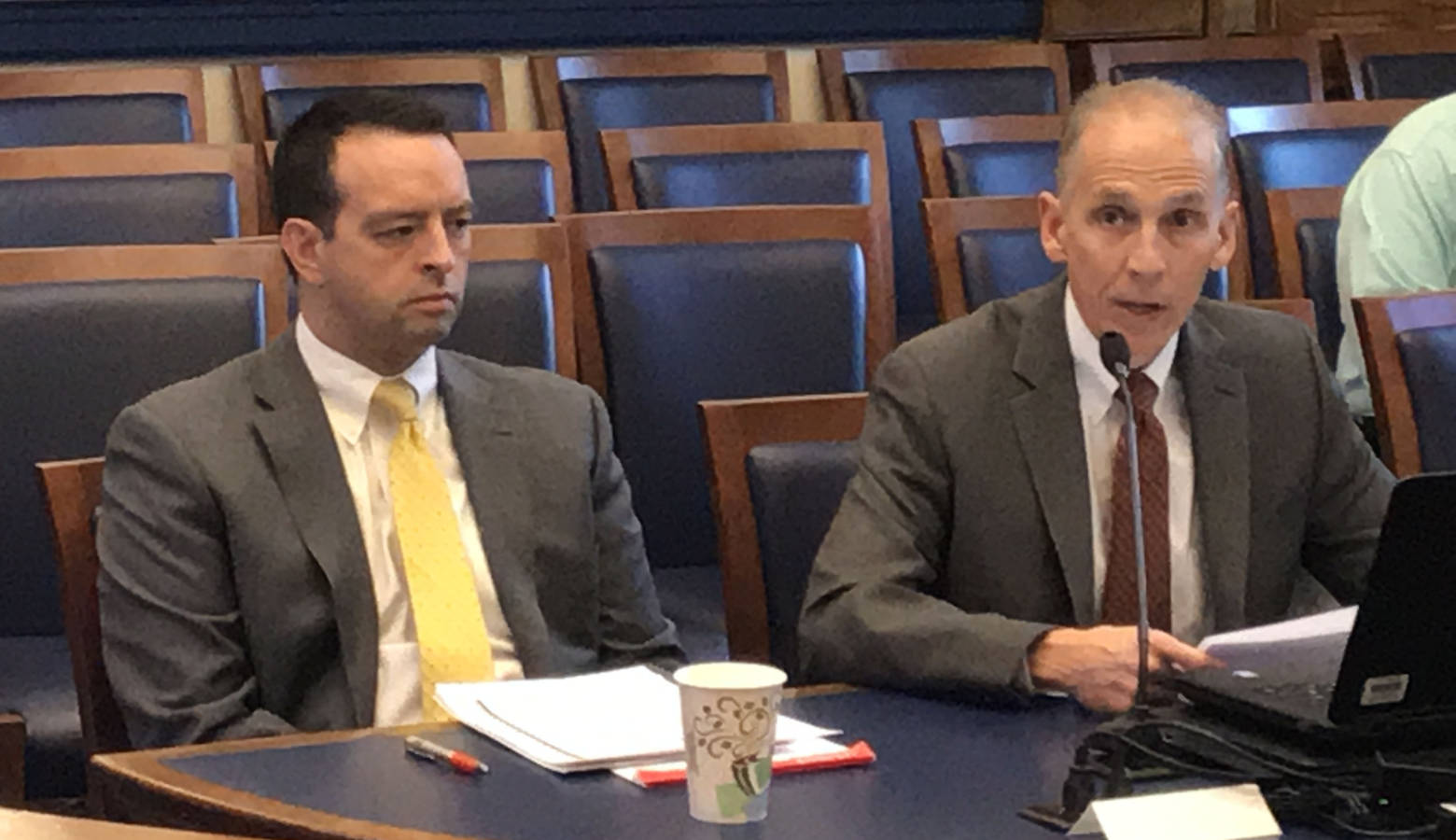 Office of Management and Budget Director Micah Vincent, left, and Indiana Finance Authority COO Jim McGoff discuss the Toll Road lease at the State Budget Commitee. (Brandon Smith/IPB News)