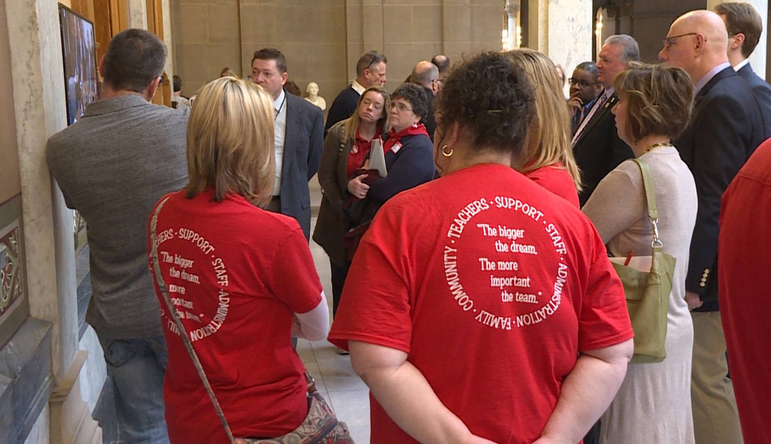 Teachers dressed in red joined other education advocates at a school funding meeting in the statehouse. (Jeanie Lindsay/IPB News)