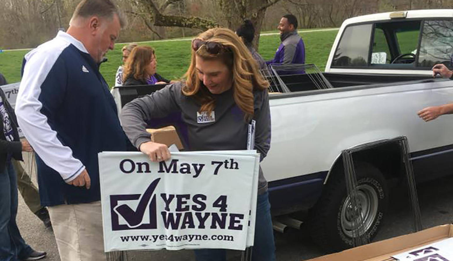Volunteers distribute signs for Wayne Township Schools ahead of the May 2019 election. (Yes4Wayne/Facebook)