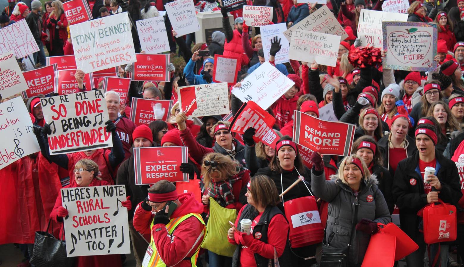 Teachers from across Indiana wave signs and chant before rallying both inside and outside of the Indiana Statehouse. (Lauren Chapman/IPB News)