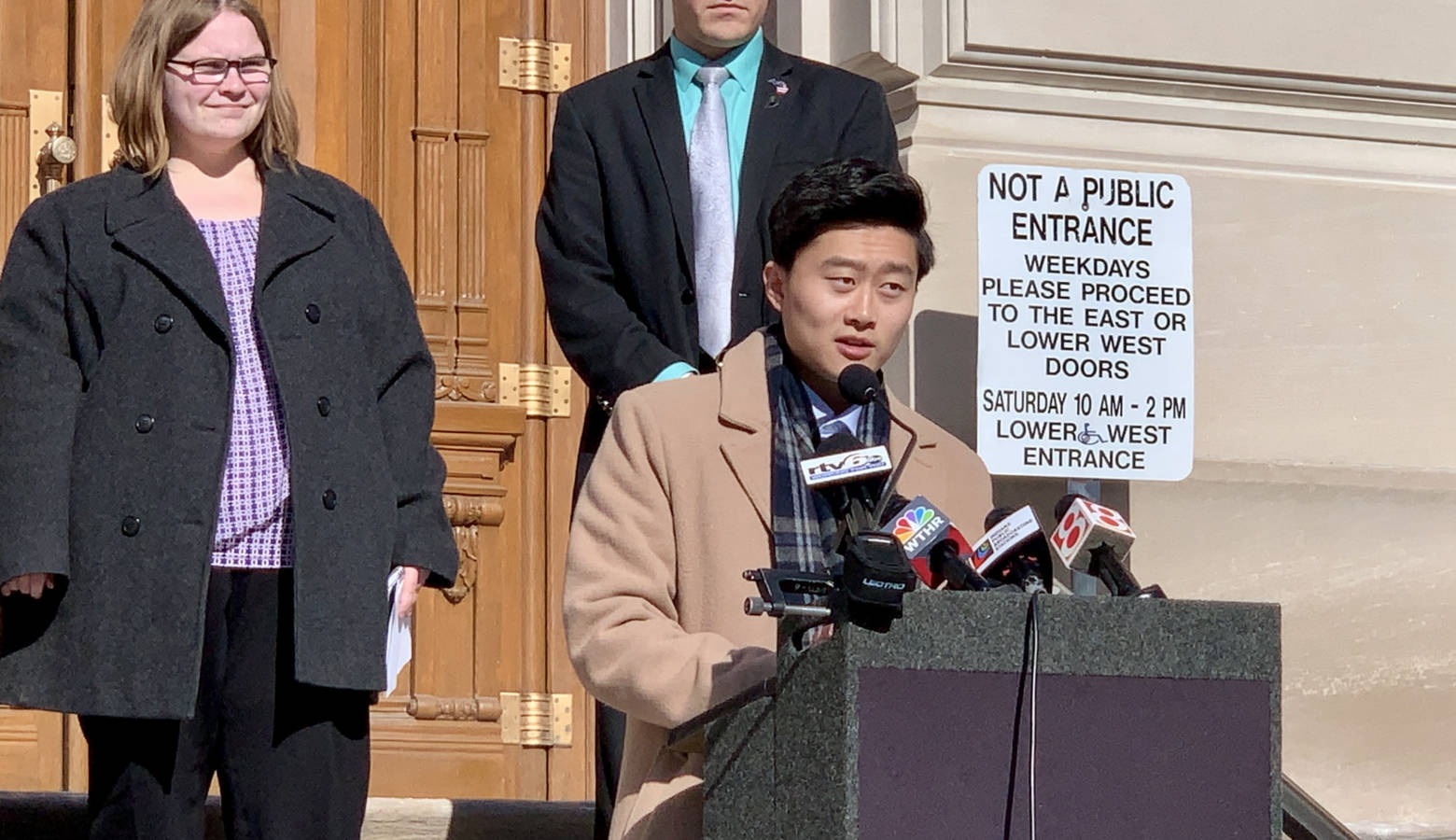 Megan Stoner, left, and Rep. Chris Chyung (D-Dyer), at lectern, support lowering the age limits to serve in the Indiana General Assembly. (Brandon Smith/IPB News)