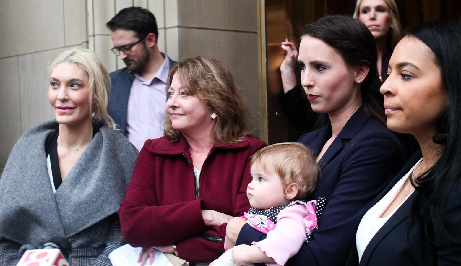 (Left to right) Former gymnasts Sarah Klein, Marcia Frederick, Rachael Denhollander and Tasha Schwikert respond to questions outside the Birch Bayh Federal Building & U.S. Courthouse. (Samantha Horton/IPB News)