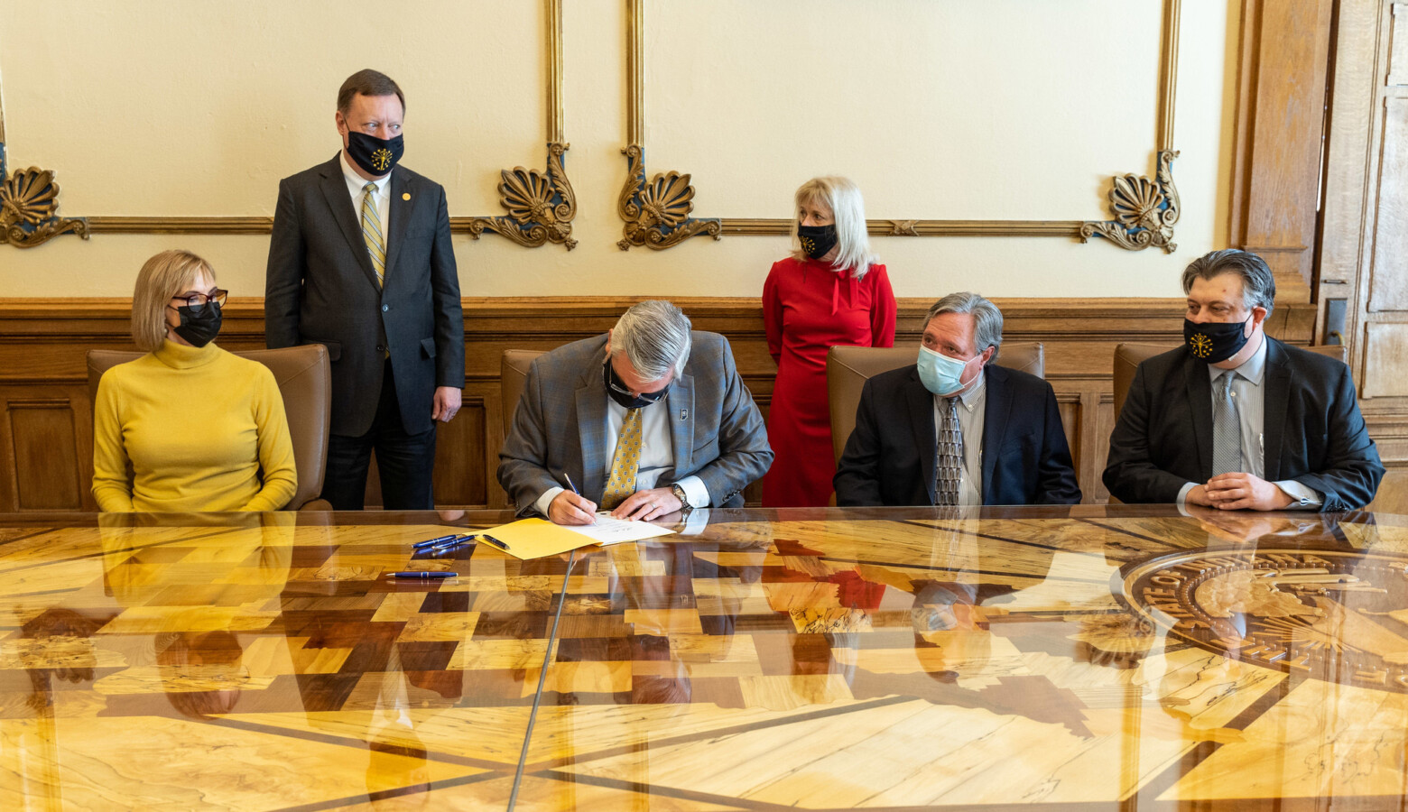 Gov. Eric Holcomb signed Senate Bill 1 into law Thursday. It will give businesses, schools, health care providers and others protections from COVID-19 civil lawsuits. (Governor Eric Holcomb/Flickr)