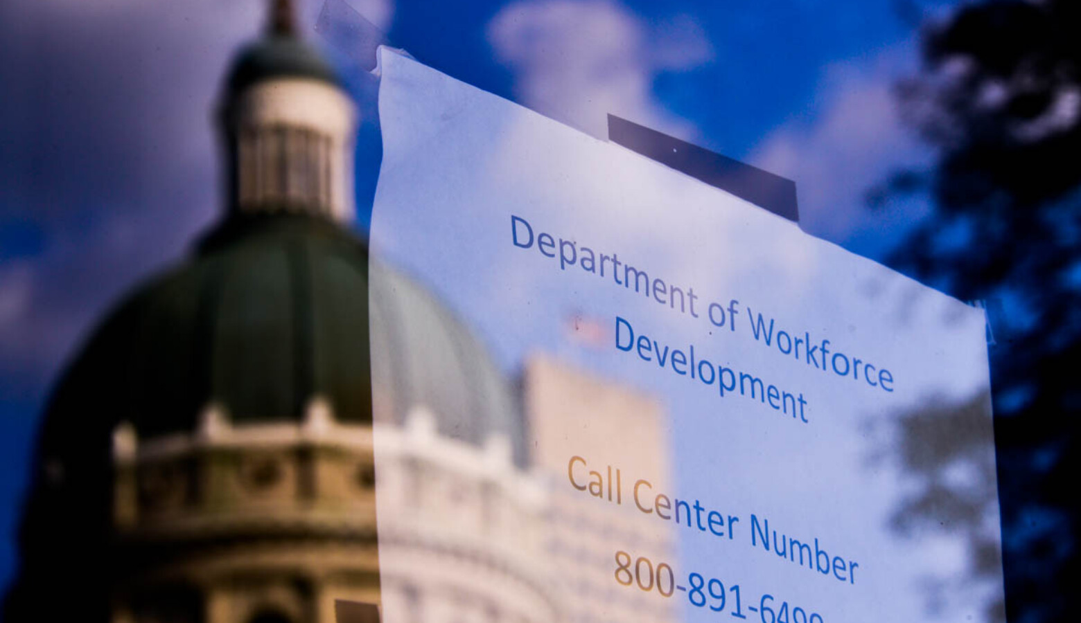 The reflection of the statehouse in the Department of Workforce Development headquarters in Indianapolis. (Justin Hicks/IPB News)