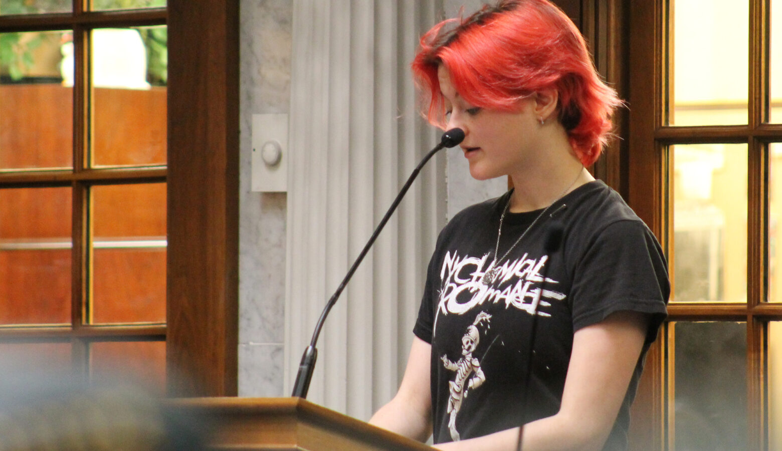 A student testifies in favor of access to health care for transgender Hoosiers on the floor of the state Senate.