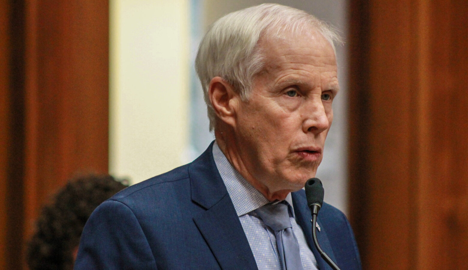 Rep. Bob Behning speaks into a microphone