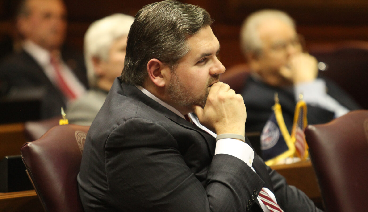 Representative Ed Clere sits at his desk in the Indiana House of Representatives.