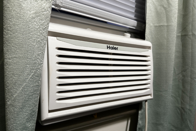 A window A/C unit in an apartment.