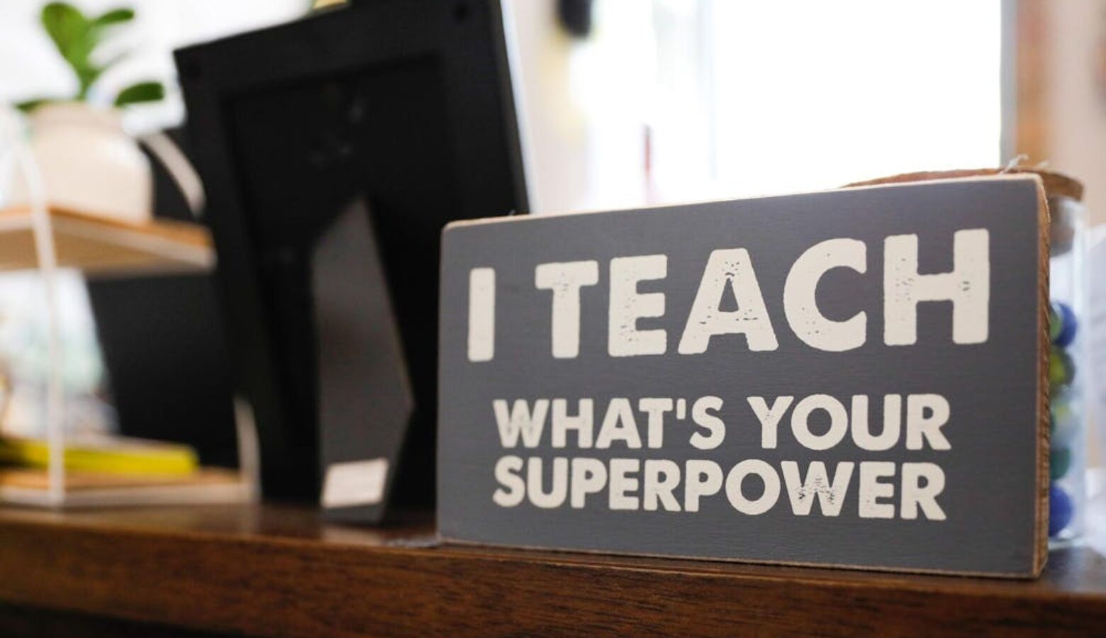 A sign reading, “I teach; what’s your superpower?” on fourth grade teacher Heather Veatch’s desk Oct. 1 at East Washington Academy.