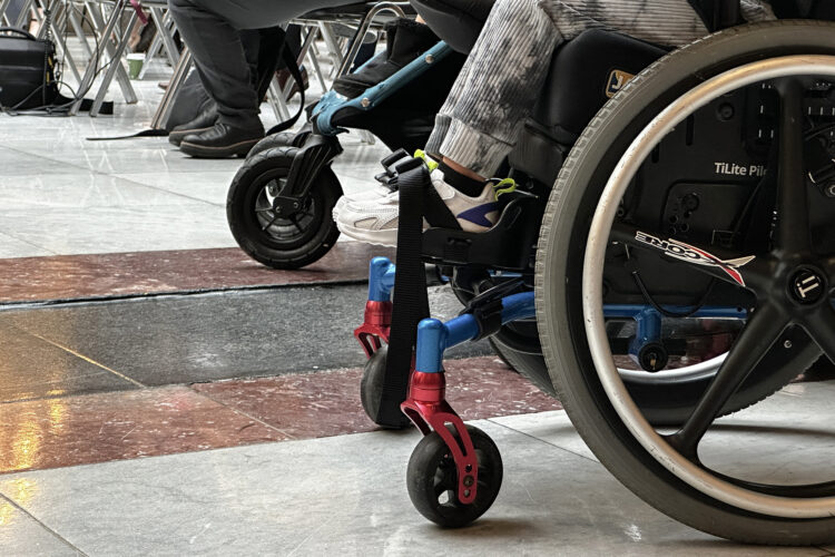 A child sitting in a wheelchair at the Indiana Statehouse.