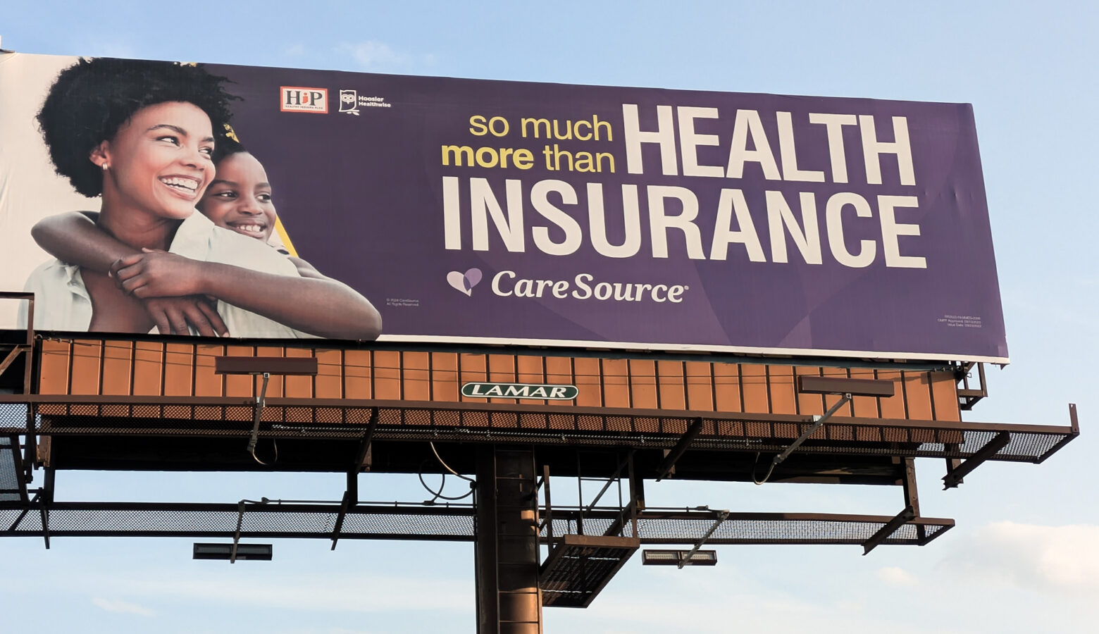 A billboard for the Health Indiana Plan reads 'so much more than health insurance.'