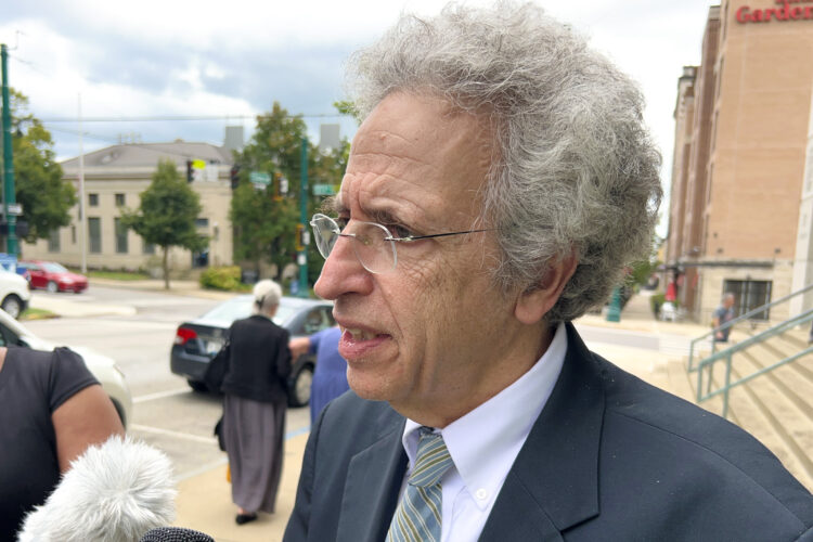 ACLU of Indiana's Legal Director Ken Falk speaks outside of a courthouse.