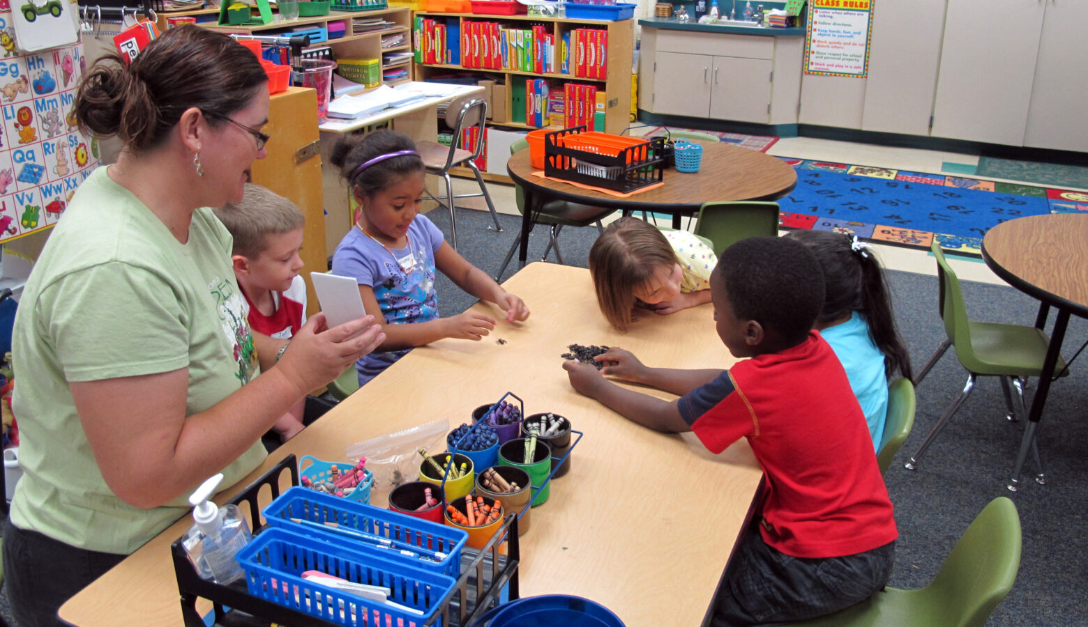 Students at a pre-kindergarten camp in Avon, Indiana play a counting game.