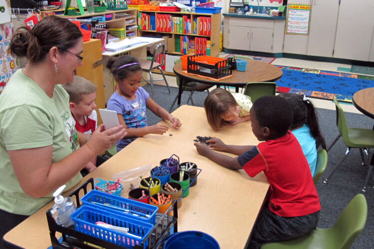 Students at a pre-kindergarten camp in Avon, Indiana play a counting game.