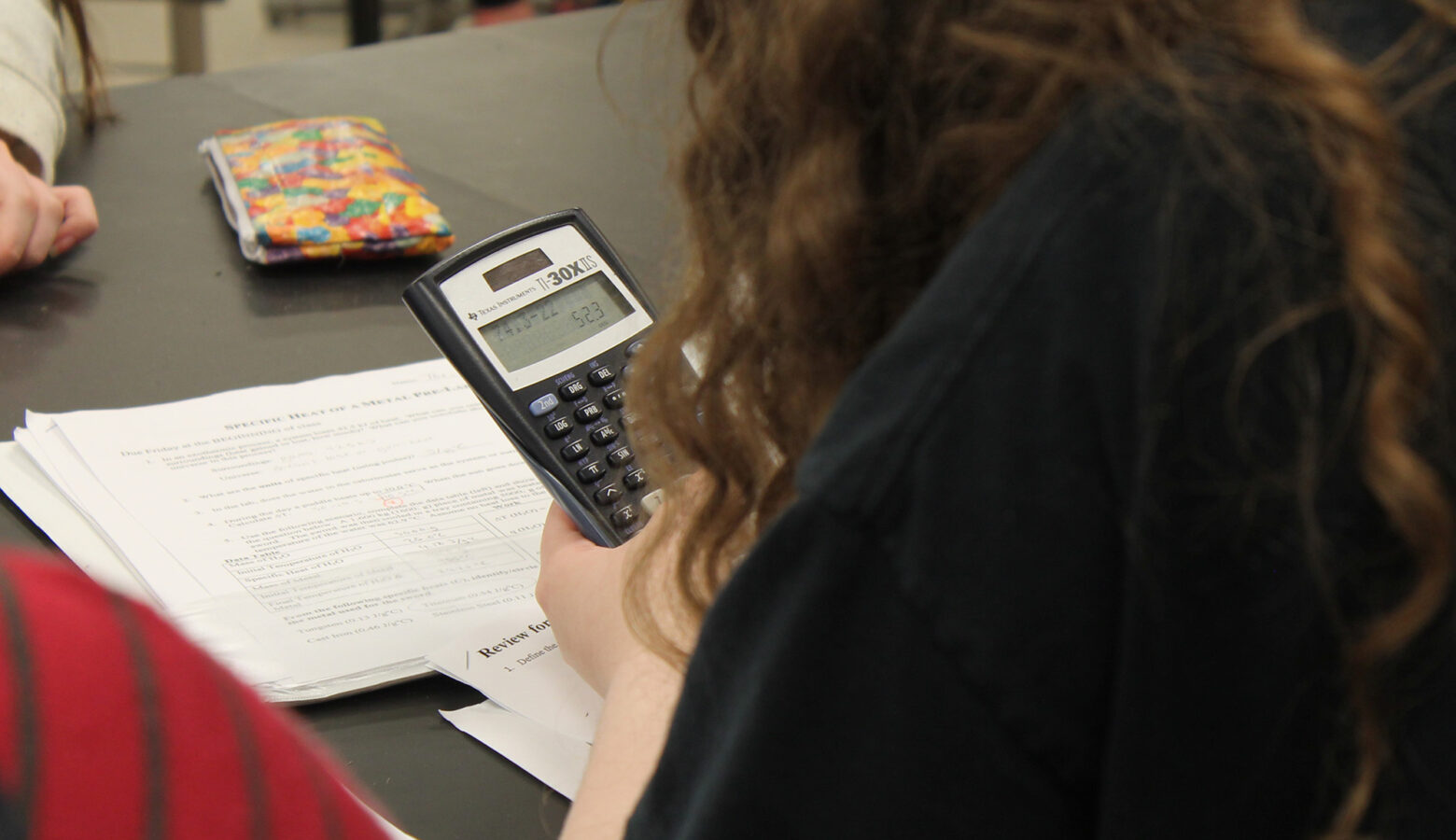 A student uses a calculator in class.