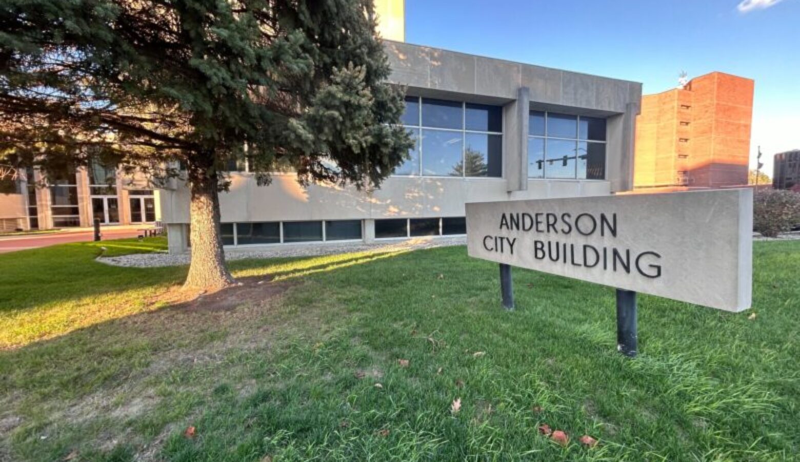 A brick building with large windows on its second floor. The words Madison County Government Center are spelled out on the wall.