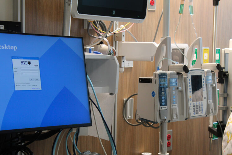 A computer for medical documentation, next to various medical tools.