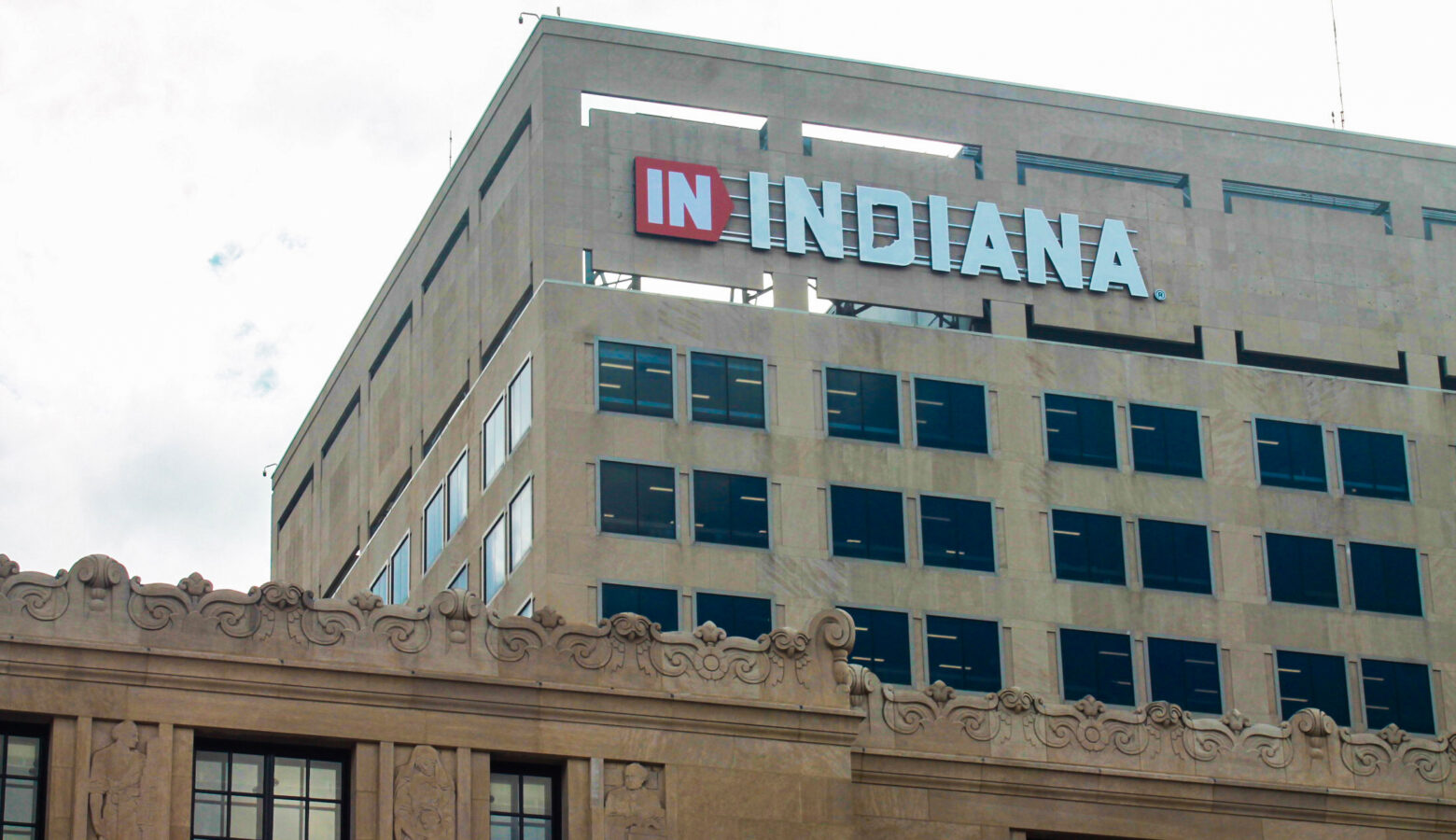 A state government building in downtown Indianapolis. Across the top of the building is a sign that reads "In Indiana."