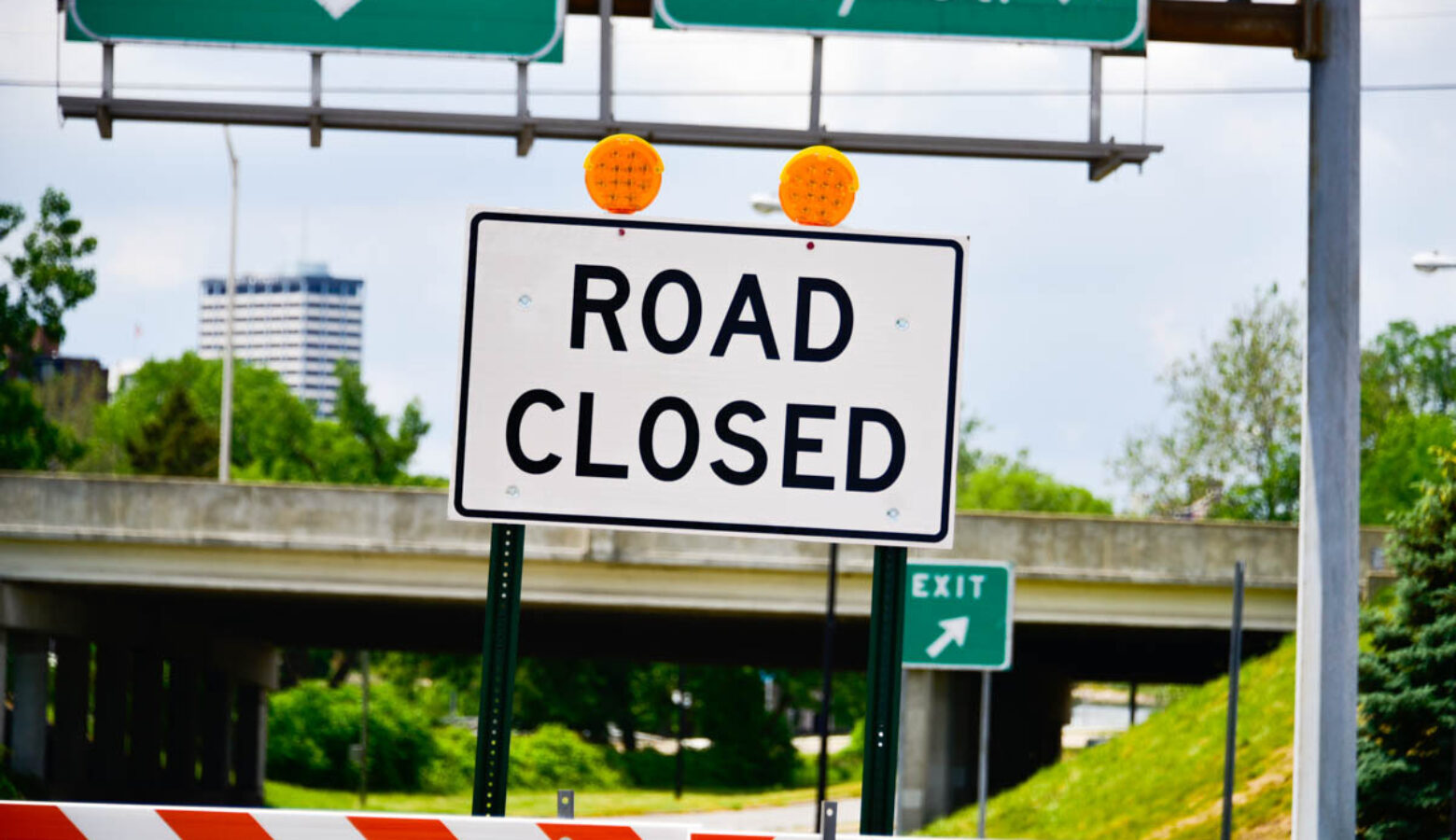 A road sign reads "Road Closed."