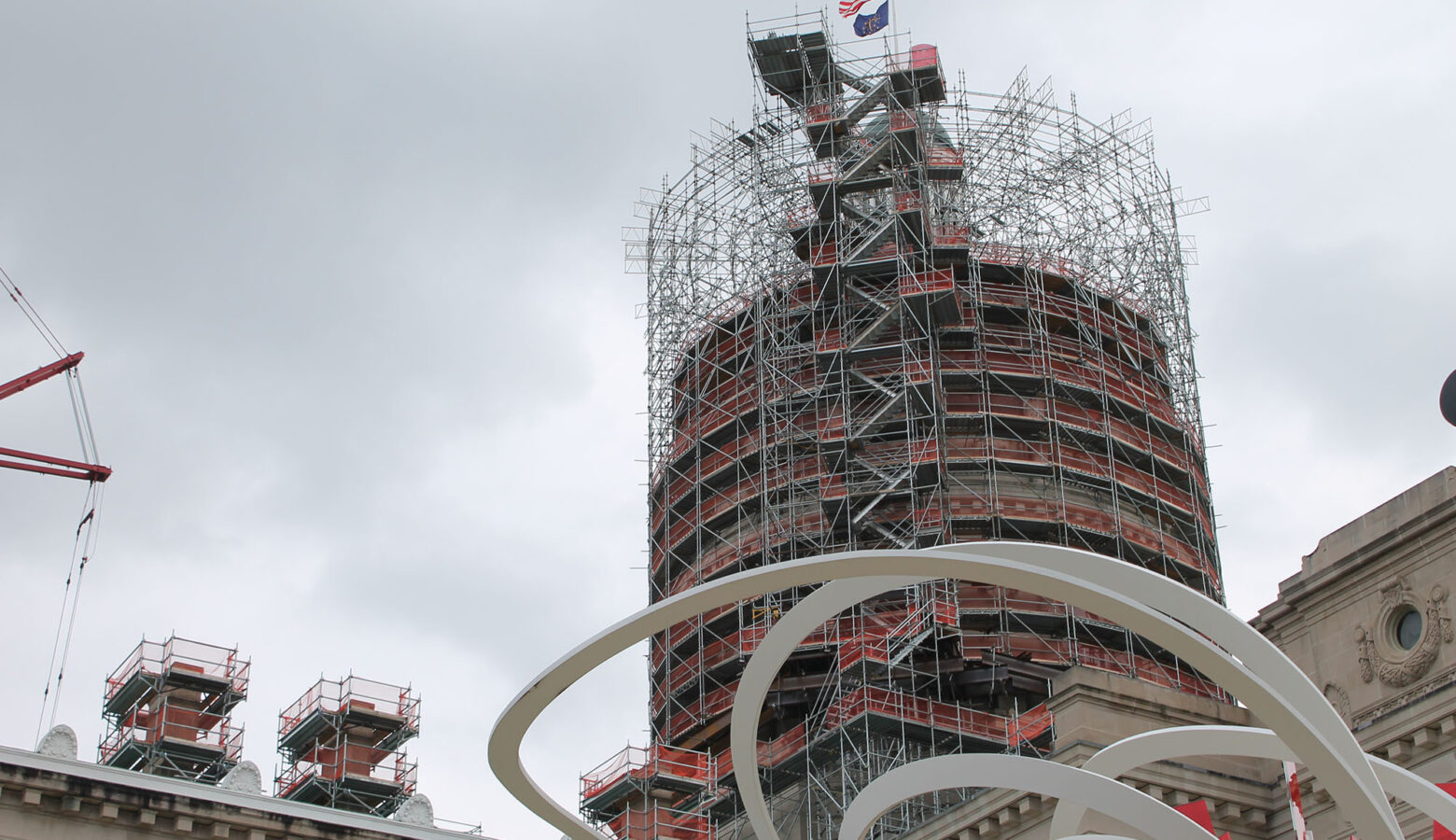 The western exterior of the Indiana Statehouse. The dome is surrounded by scaffolding.