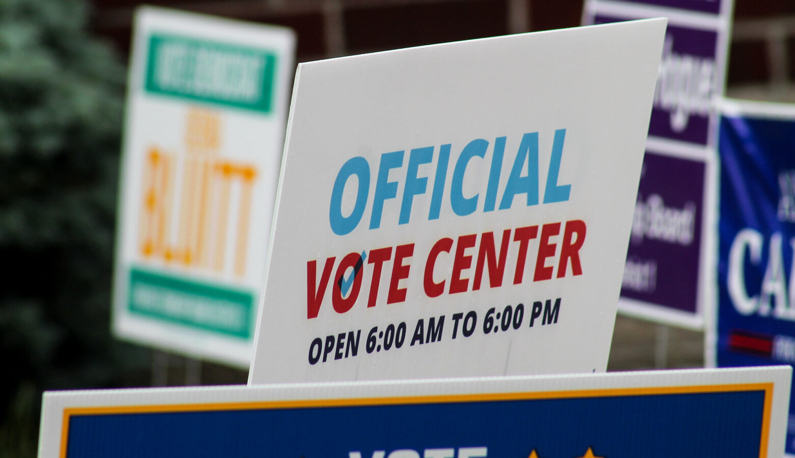 A lawn sign reads "Official Vote Center."