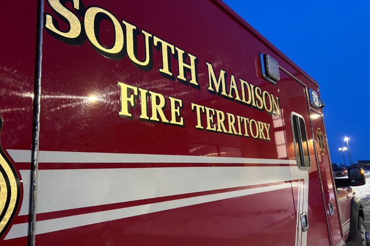 The side of an ambulance with the words South Madison Fire Territory on it