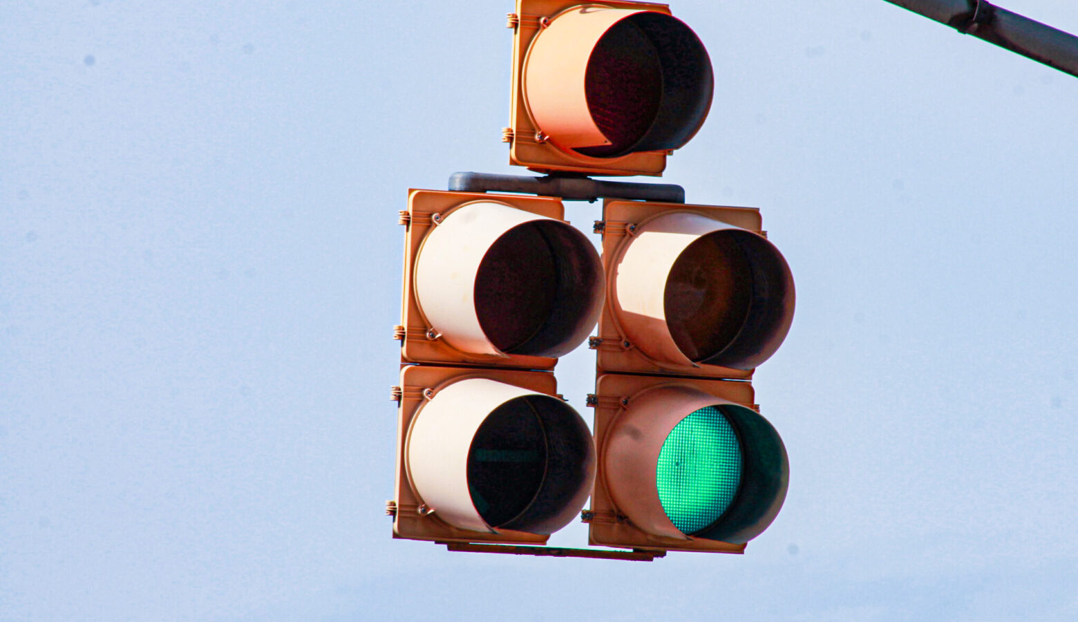 A stop light, with the green illuminated.