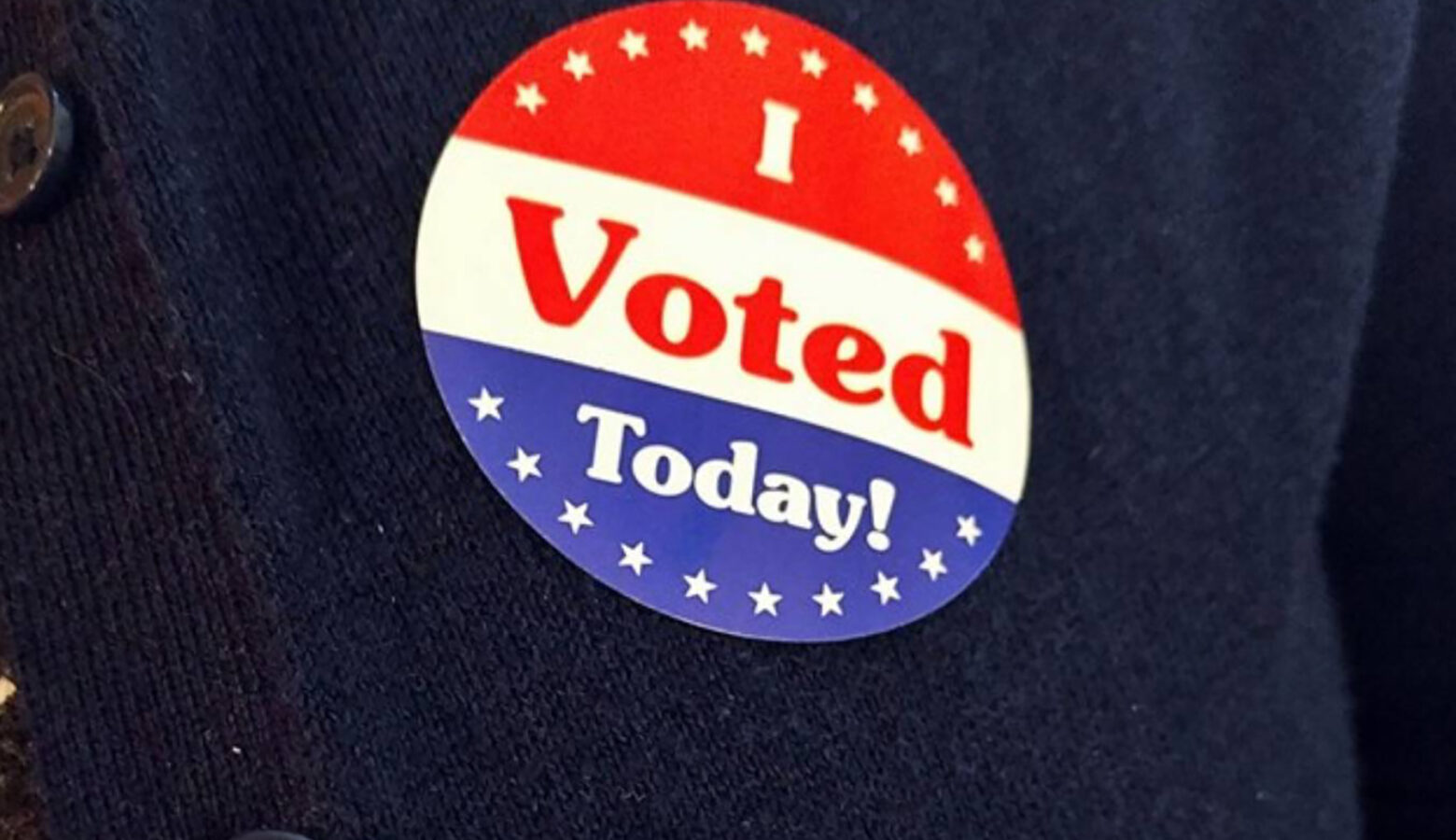 A sticker on a sweater reads "I Voted Today!"