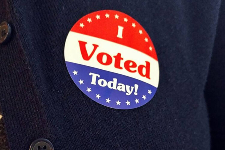 A sticker on a sweater reads "I Voted Today!"