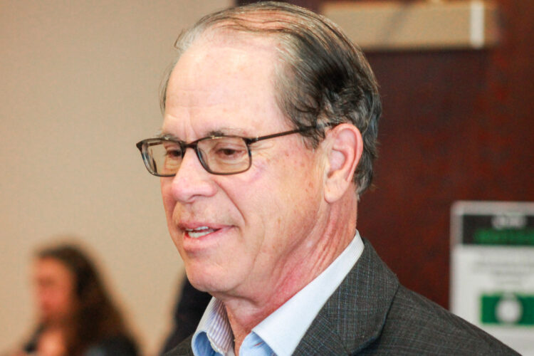 Mike Braun is a White man, balding with dark hair. He is wearing glasses.