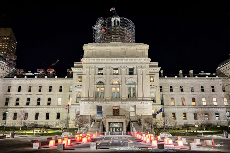 The western exterior of the Indiana Statehouse, at night.