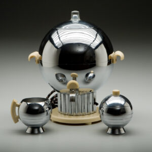 Chrome-plated “Coronet” Coffee Urn by Walter von Nessen with a spherical design, beige Bakelite handles and base, reflecting early 20th-century futurist aesthetics.