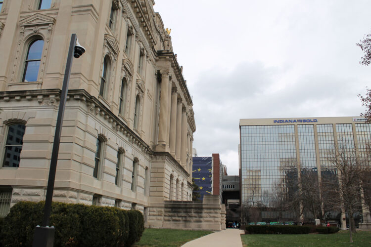 The southern exterior of the Indiana Statehouse is on the left, while the Indiana Economic Development Corporation building is on the right.