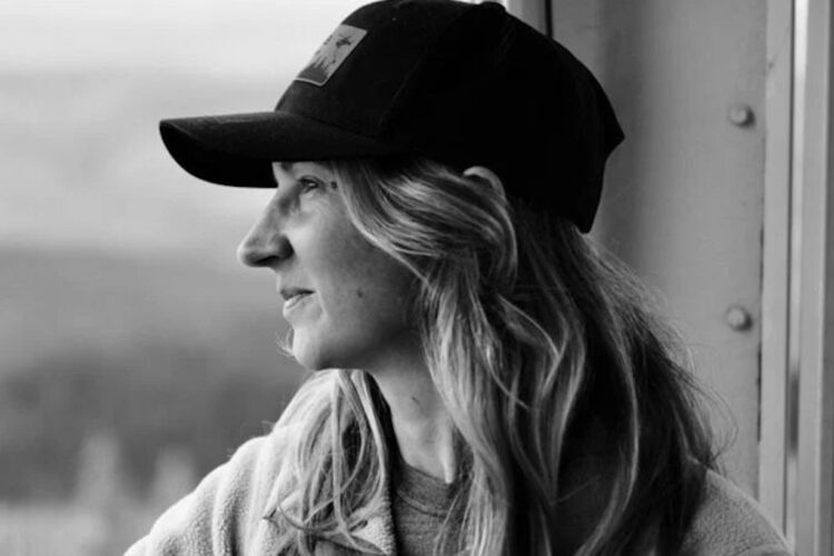 Trina Moyles facing out a window.