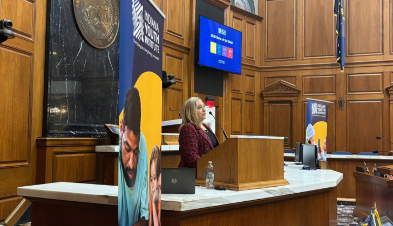 IYI President and CEO Tami Silverman presented new data at the annual State of the Child event at the Statehouse February 16th, 2026. She is speaking at the main podium in the Indiana House chamber.