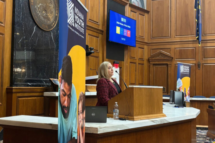 IYI President and CEO Tami Silverman presented new data at the annual State of the Child event at the Statehouse February 16th, 2026. She is speaking at the main podium in the Indiana House chamber.