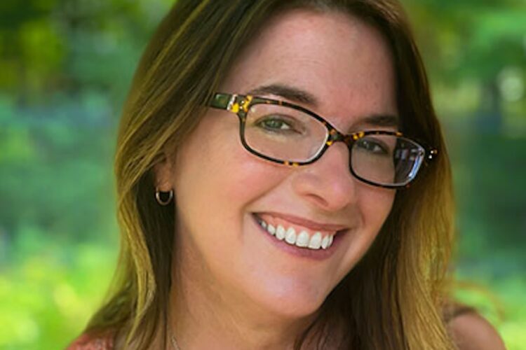 Jill Christman outdoors smiling.