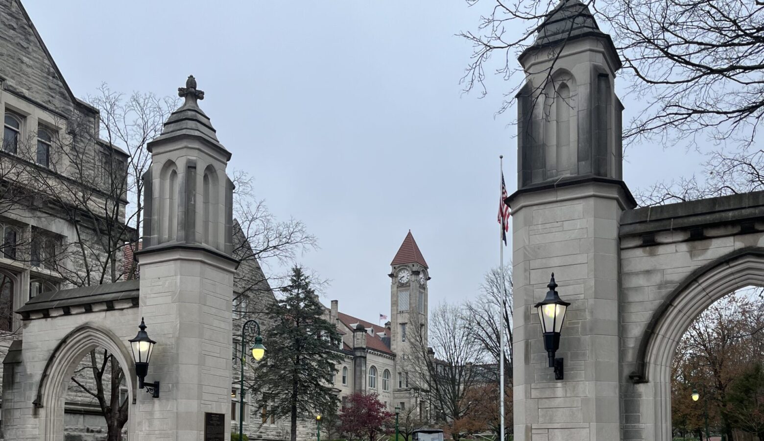 Indiana University's Sample Gates are made of gray stone and topped with pyramid-shaped caps.