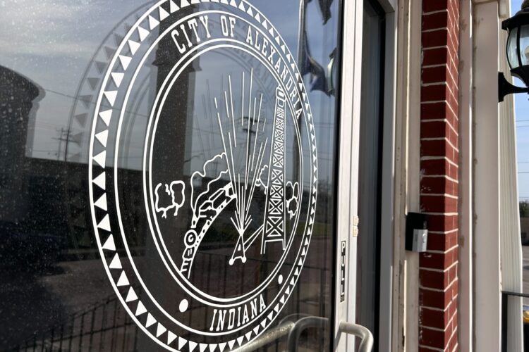 A glass door with a logo on it for the City of Alexandria