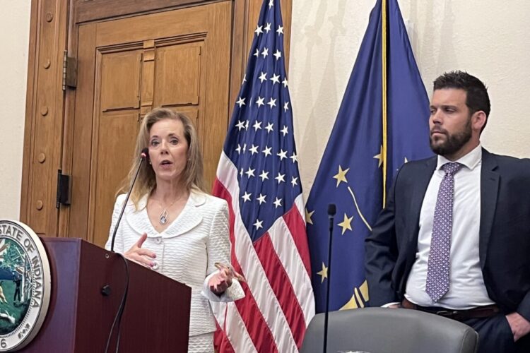 Indiana Secretary of Management and Budget Lisa Hershman speaks alongside State Budget Director Chad Ranney during a news conference.