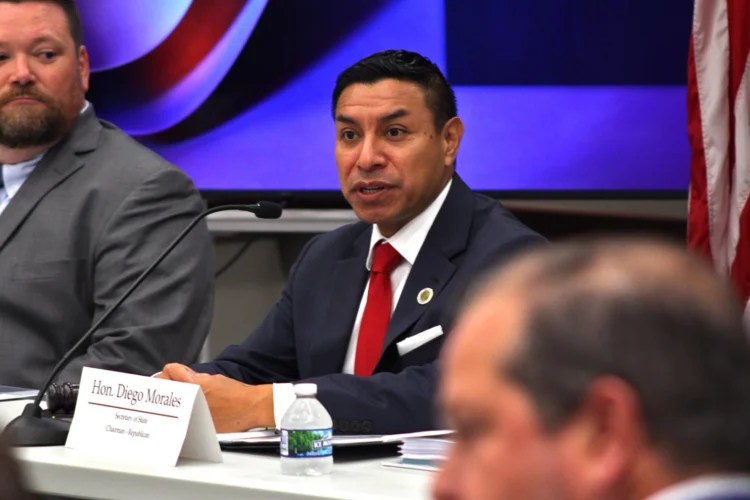 Indiana Secretary of State Diego Morales sits at a table during a meeting of the state Election Recount Commission.